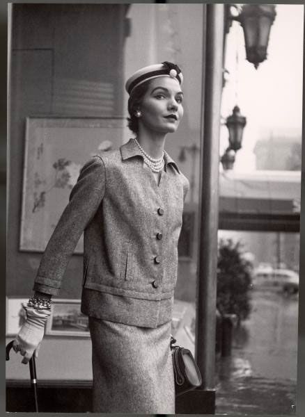 "Model posing in British fashion designer Digby Morton's box jacket which goes over matching slip," 1952.